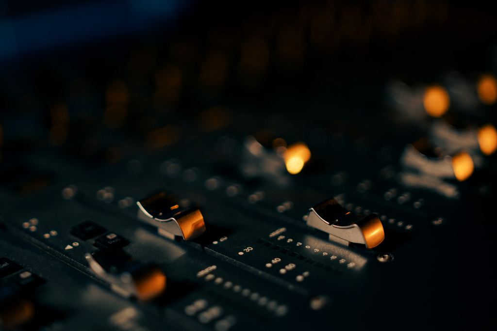 Close-up of faders on a mixing controller.